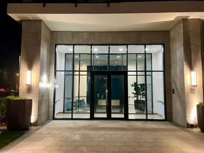 an entrance to a building with a large glass door at BW Studio Metropolitan in Belgrade