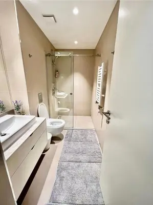 a bathroom with a shower and a toilet and a sink at BW Studio Metropolitan in Belgrade