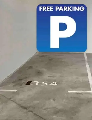 a parking sign on the floor of a parking garage at BW Studio Metropolitan in Belgrade