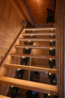 an overhead view of a wooden staircase in a cabin at A-Frame Wellness Villa with Private Pool, Sauna & Jacuzzi near Belgrade in Koraćica
