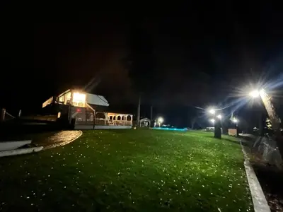 a park at night with lights in the grass at Elowen in Novo Selo