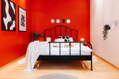 a red bedroom with a bed in a room at Soul House 110m2 with Balcony & Foosball Old Town in Belgrade
