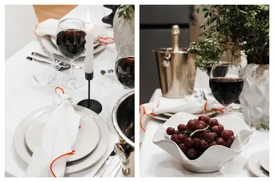 a table with a glass of wine and a bowl of grapes at Soul House 110m2 with Balcony & Foosball Old Town in Belgrade