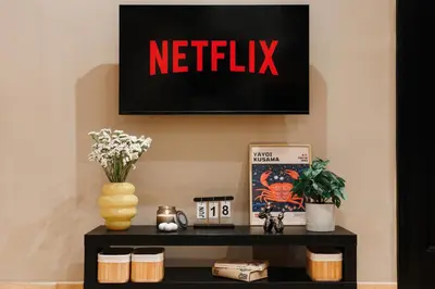 a black shelf with a netflix sign on a wall at Soul House 110m2 with Balcony & Foosball Old Town in Belgrade