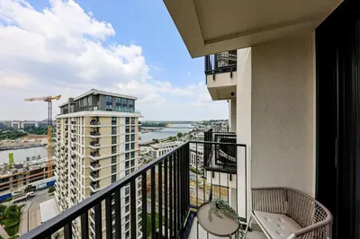 a balcony with a view of a city at ZIGZAG Belgrade Waterfront Metropoliten in Belgrade