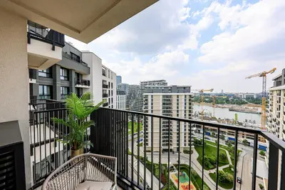 a balcony with a view of a city at ZIGZAG Belgrade Waterfront Metropoliten in Belgrade