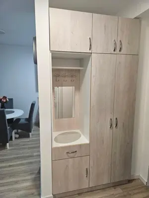 a bathroom cabinet with a sink in a room at Miss LuX in Mladenovac