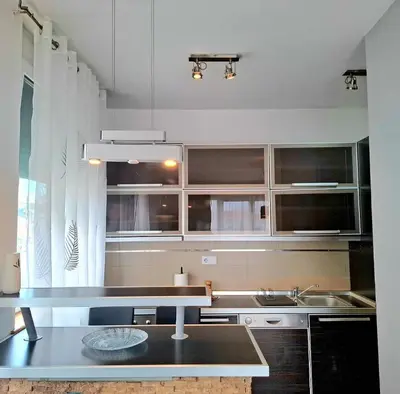 a kitchen with a sink and a counter top at BelMont Vračar in Belgrade