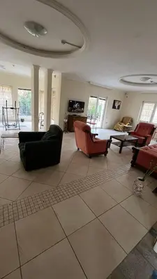 a large living room with couches and a table at Vila Monika in Belgrade