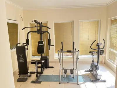 a gym with several exercise bikes and treadmills at Vila Monika in Belgrade