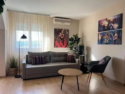 a living room with a couch and a table at R&R apartment Medak 3 in Belgrade