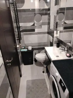 a small bathroom with a toilet and a sink at EXPO Prime New Belgrade Ledine in Ledine