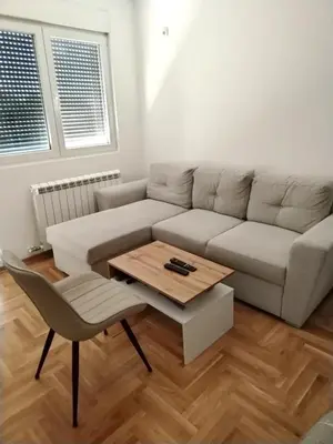 a living room with a couch and a coffee table at EXPO Prime New Belgrade Ledine in Ledine