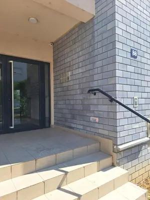 a set of stairs leading to a building with a door at Amar6 in Novi Beograd