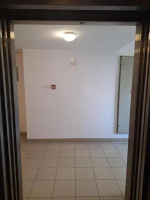 a room with a white wall and a tile floor at Amar6 in Novi Beograd