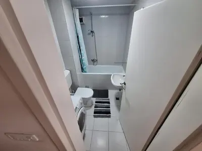 a bathroom with a toilet and a sink and a tub at Amar6 in Novi Beograd