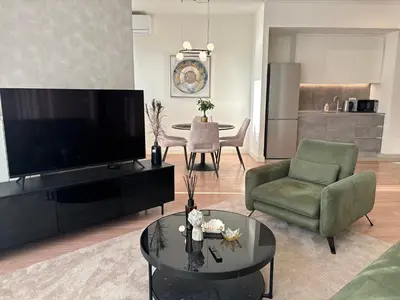 a living room with a large flat screen tv at BW AQUA Joi Lux 2 Apartment in Belgrade