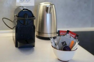 a counter top with a blender and a cup of food at Scala Reale in Sajmište
