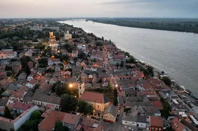 an aerial view of a town next to a river at Oasis Moonze in Zemun