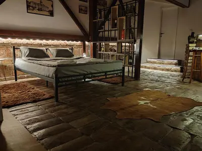 a bedroom with a bed in the middle of a room at Airport Apartment AIR 2 in Surčin