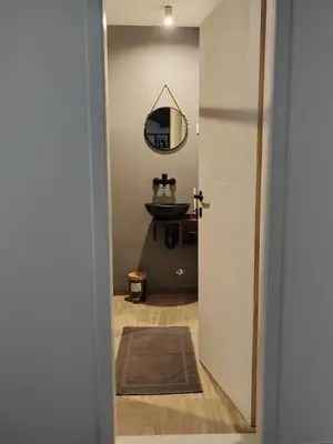 a bathroom with a sink and a mirror at Airport Apartment AIR 2 in Surčin