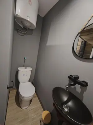 a bathroom with a toilet and a sink at Airport Apartment AIR 2 in Surčin