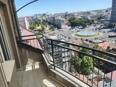 a balcony of a building with a view of a city at Urban nest Slavija in Belgrade
