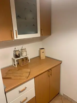 a kitchen with a wooden counter top in a kitchen at Urban nest Slavija in Belgrade