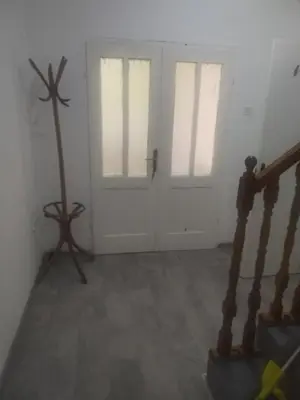 an empty room with two doors and a staircase at Apartman M&D in Pančevo