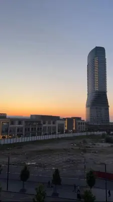 a tall building in a city at sunset at Beograd na vodi VSLE in Belgrade