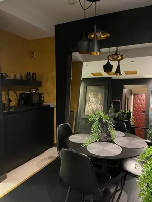 a kitchen and dining room with a table and chairs at Knez in Belgrade