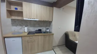 a small kitchen with a counter and a sink at Apartman Masa in Arandjelovac