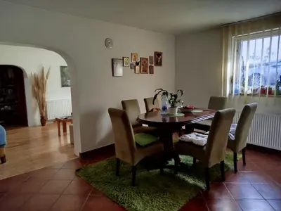 a dining room with a table and chairs at Bukuljska kuća in Arandjelovac