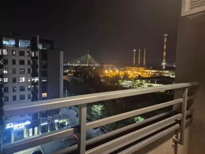 a view of a city at night from a balcony at Lastavica residence, modern luxury apartment with garage in Novi Beograd