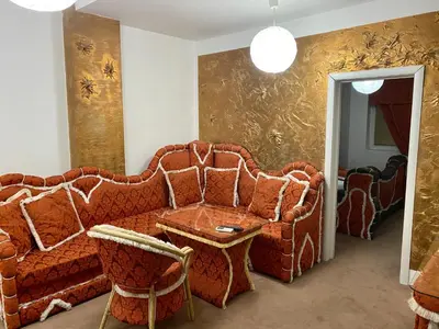 a living room with a couch and a table at Bali Colosseum Hotel in Belgrade