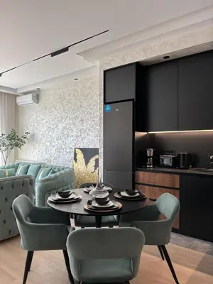 a living room with a table and chairs at Elegant 2BR BW Apartment 2 Bathrooms -Private Garage A1 Residence Bw in Belgrade