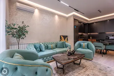 a living room with blue couches and a table at Elegant 2BR BW Apartment 2 Bathrooms -Private Garage A1 Residence Bw in Belgrade