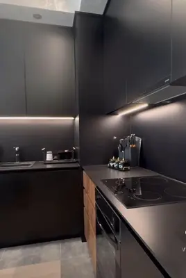 a black kitchen with a sink and a stove at Elegant 2BR BW Apartment 2 Bathrooms -Private Garage A1 Residence Bw in Belgrade