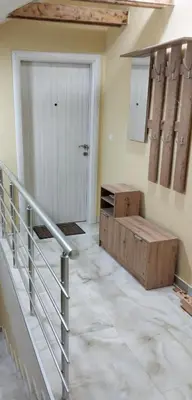 a room with a staircase and a door and a stair case at Miran San Apartment Belgrade in Mali Mokri Lug
