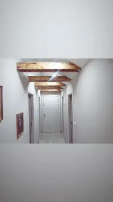 a room with a hallway with a ceiling at Miran San Apartment Belgrade in Mali Mokri Lug