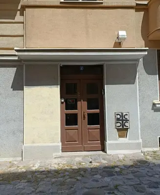 a building with a brown door with numbers on it at Urban Garden Apartments - Iris in Belgrade