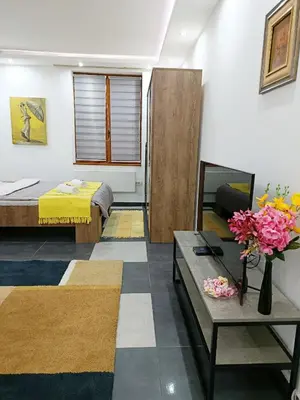 a room with a bed and a couch and a table at Urban Garden Apartments - Iris in Belgrade