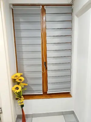 a window with a vase of flowers in a room at Urban Garden Apartments - Sunflower in Belgrade