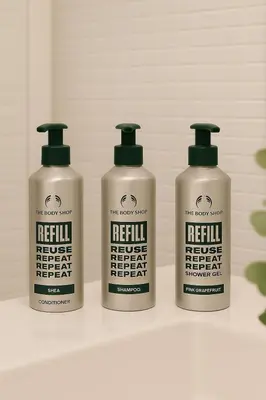 a group of four bottles of reiki moisturizers on a shelf at Ollio Quiet City Center Apartments in Belgrade