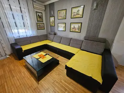 a living room with a couch and a table at Zora apartment in Belgrade