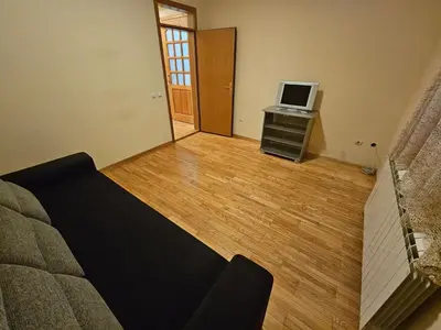 a living room with a couch and a television at Zora apartment in Belgrade