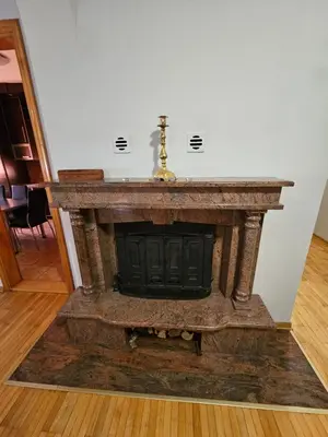 an old stone fireplace in a living room at Zora apartment in Belgrade