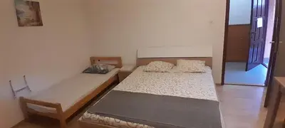 a bedroom with two beds in a room at Airport Nikki Apartments in Belgrade