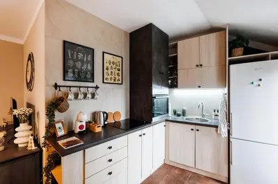 a kitchen with white cabinets and a white refrigerator at Heart Strings with Terrace 290 Mbps Old Town in Belgrade