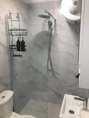 a bathroom with a shower and a toilet and a sink at Beograd stan na dan in Novi Beograd